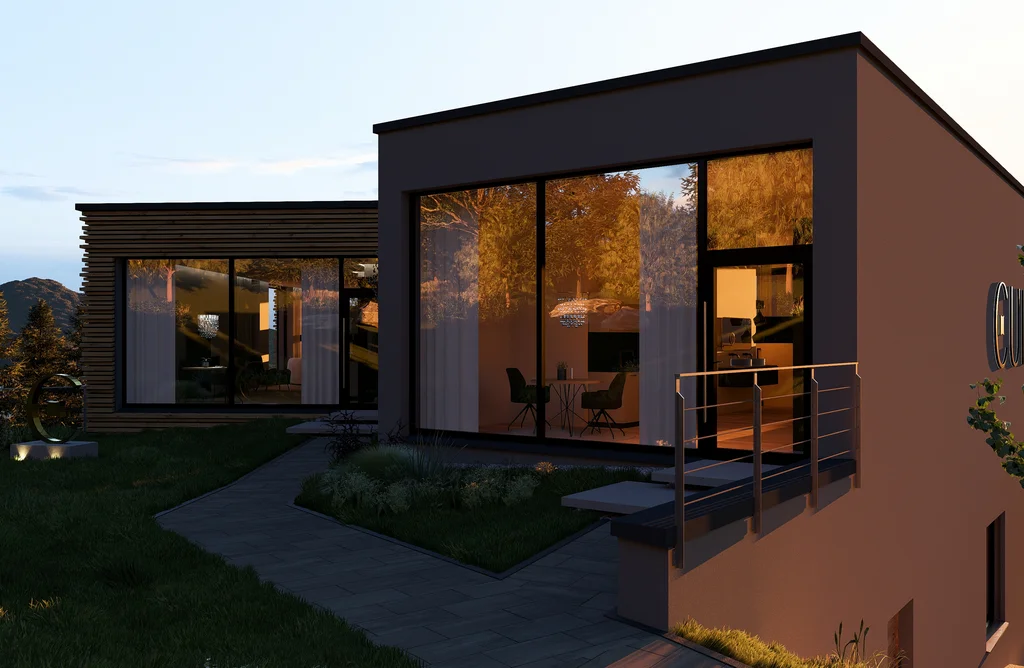 Modernes Haus mit großen Fenstern und Abendbeleuchtung im Grünen